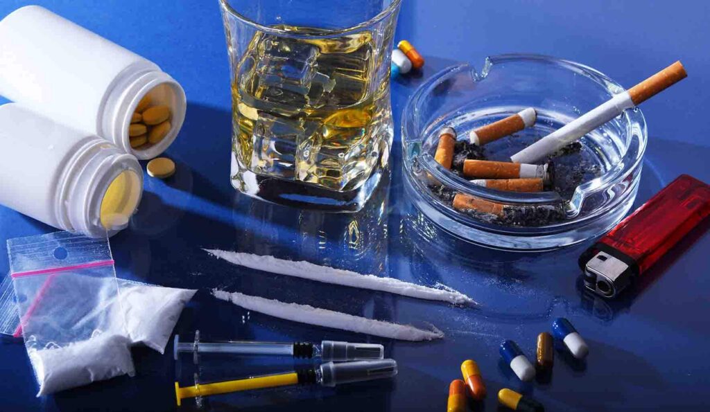 Drugs, alcohol and cigarettes on a table