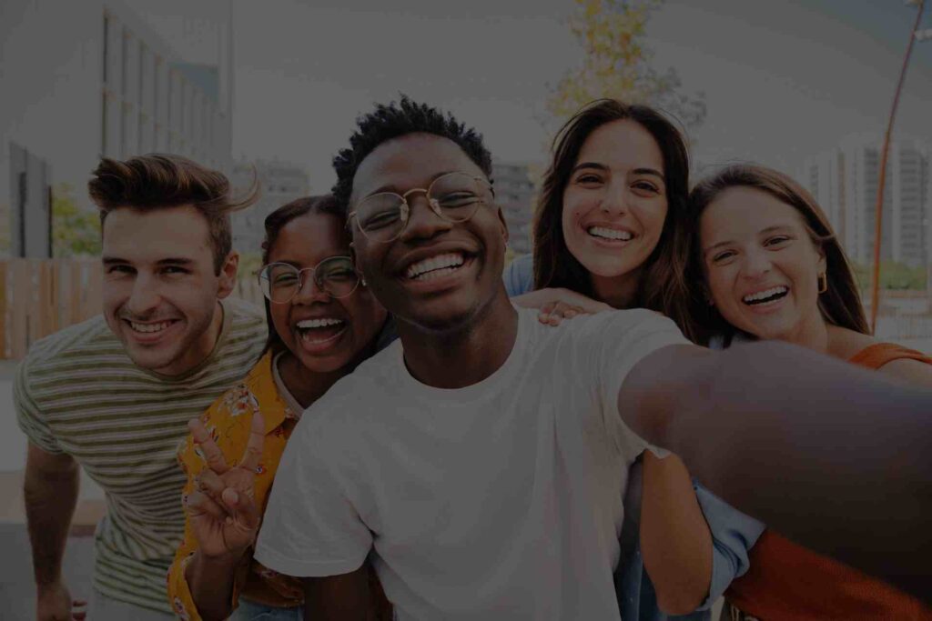 Group of friends showing happiness and social support during dual diagnosis recovery