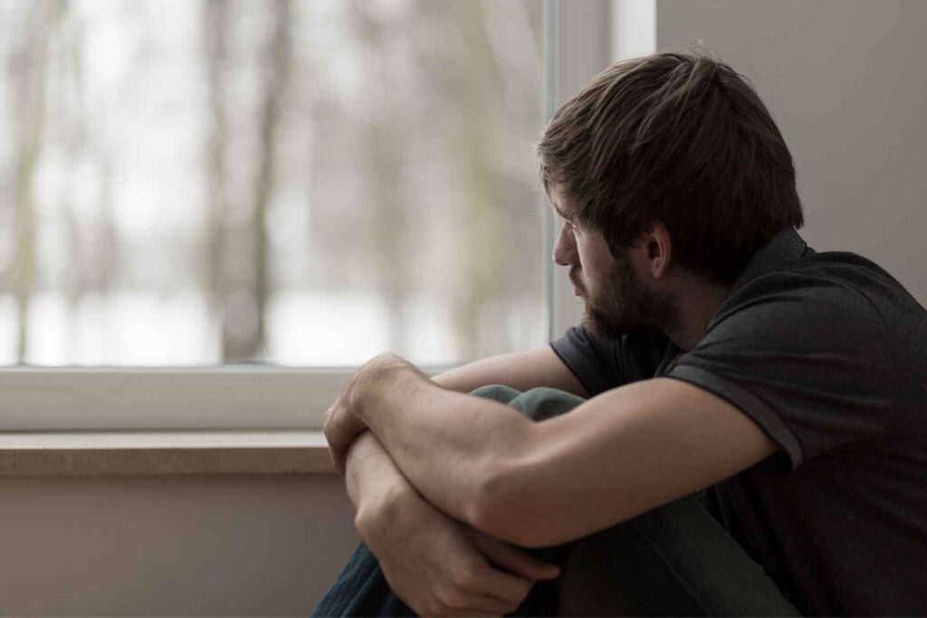 Man experiencing depression while dealing with co-occurring substance use concerns